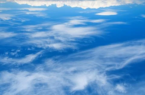 White clouds in the blue sky. Stock Photos