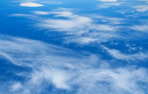White clouds in the blue sky. Stock Photos