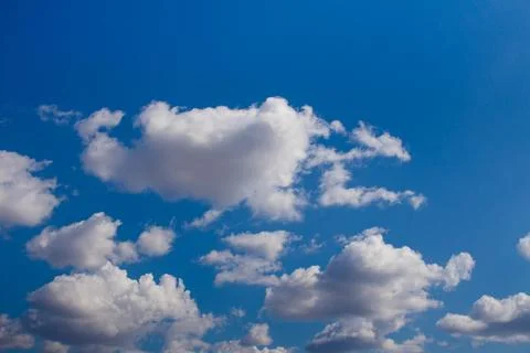 White clouds in a blue sky Stock Photos