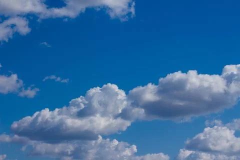 White clouds in a blue sky Stock Photos
