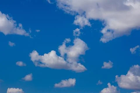White clouds in a blue sky Stock Photos