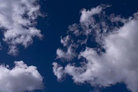White clouds in the blue sky Stock Photos