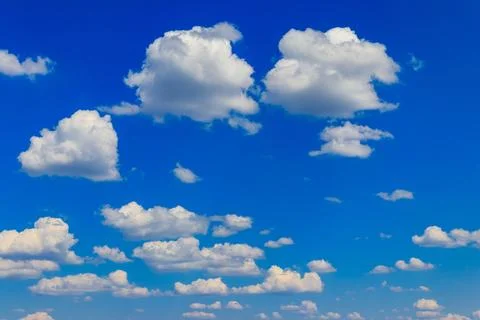 White clouds in blue sky Stock Photos