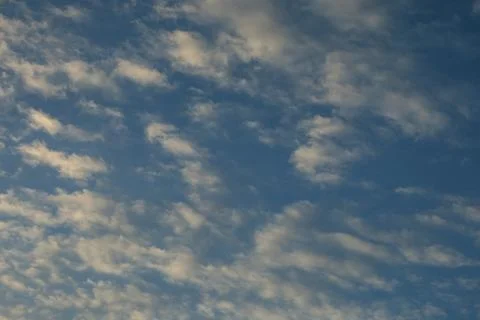 White Clouds in a Blue Sky Stockfoto's