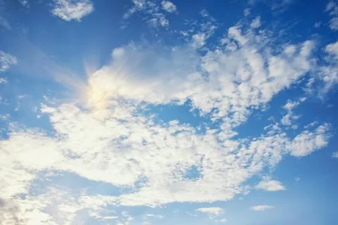 White clouds in blue sky. Sun light. Cirrocumulus cloud formation Stock-Fotos