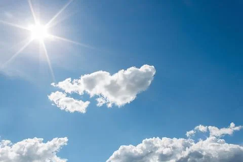 White Clouds on the blue sky with sun shines Foto stock