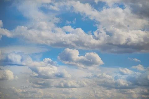 White clouds in the blue sky, sunlight on white clouds in the sky, sky landsc Stock Photos