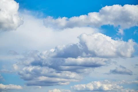 White clouds in the blue sky, sunlight on white clouds in the sky, sky landsc Stock Photos