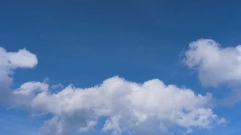 White Clouds in a Blue Sky (time lapse) Stock Footage 103829632