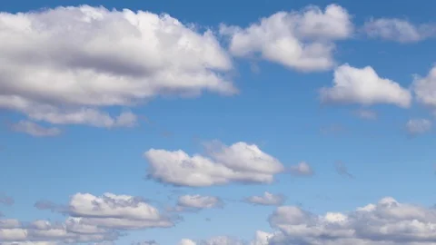 White clouds in a blue sky time lapse. Stock Footage 128809697