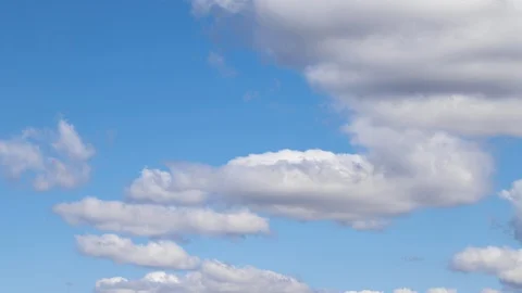 White clouds in a blue sky time lapse. Stock Footage 128809699