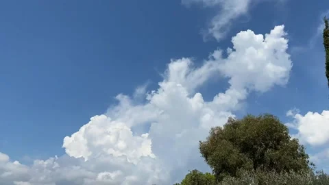 White clouds on the blue sky, time-lapse, cloudscape flow time lapse. Stock Footage 205551148