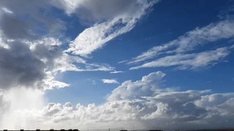 White clouds in a blue sky. Time Lapse. Stock Footage 256260648