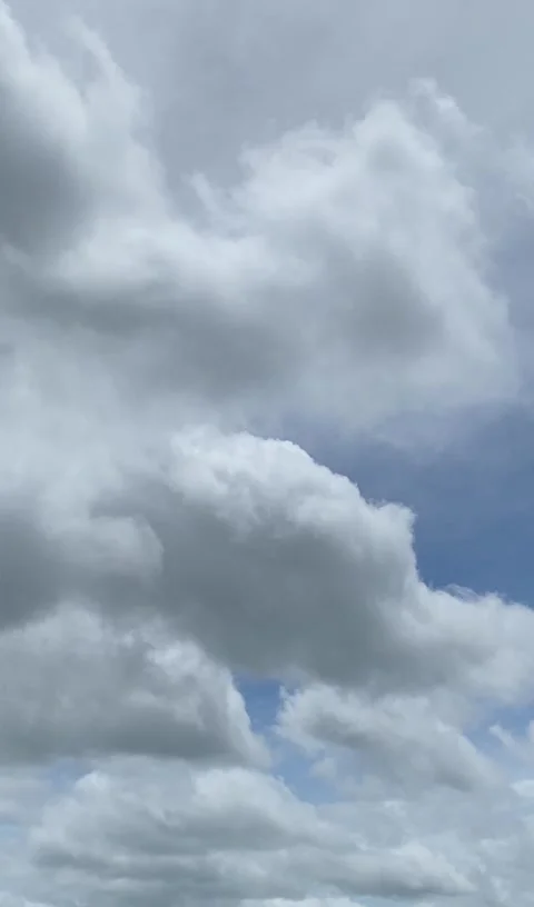 White Clouds in Blue Sky Vertical Footage Stock Footage 325016671