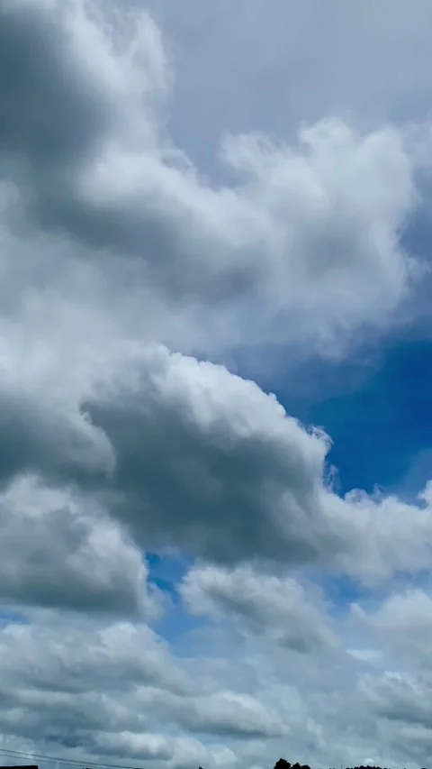 White Clouds in Blue Sky Vertical Footage Stock Footage 325016674