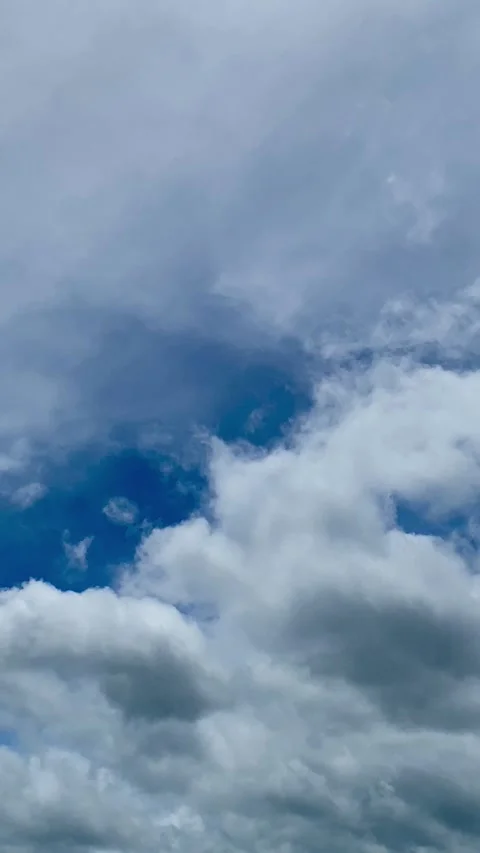 White Clouds in Blue Sky Vertical Footage Stock Footage 325016751