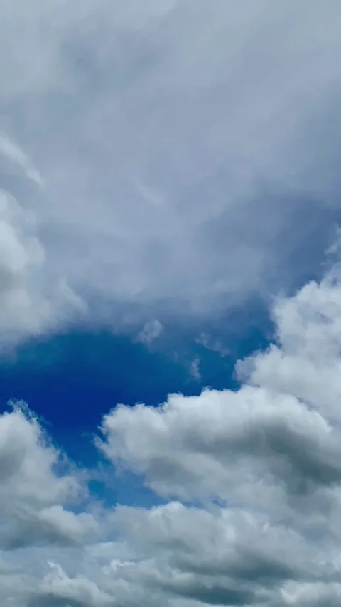 White Clouds in Blue Sky Vertical Footage Stock Footage 325016759