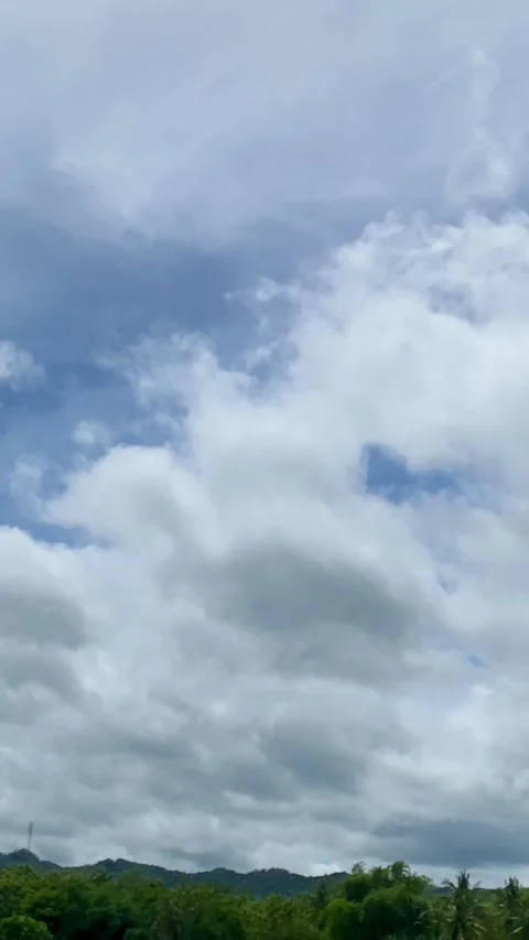 White Clouds in Blue Sky Vertical Footage Stock Footage 325016766