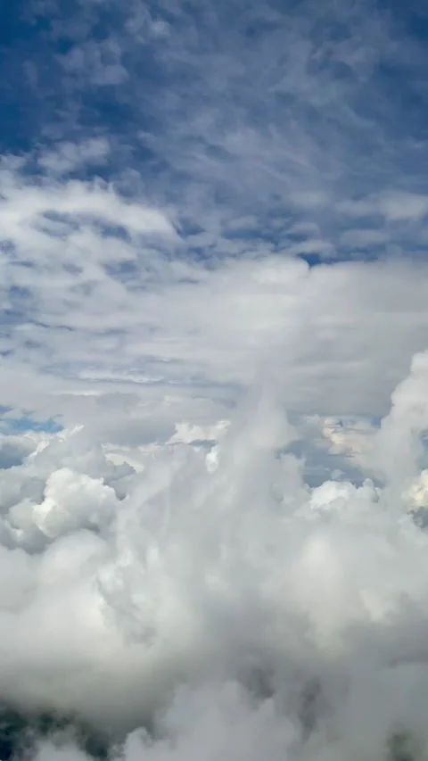 White clouds in a blue sky. view from the plane Stock Footage 305273182