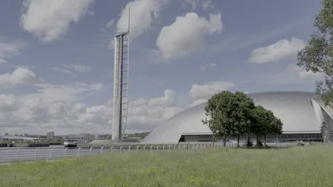 White clouds in a bright blue sky moving behind the Science Centre Tower. Stock Footage 336871327