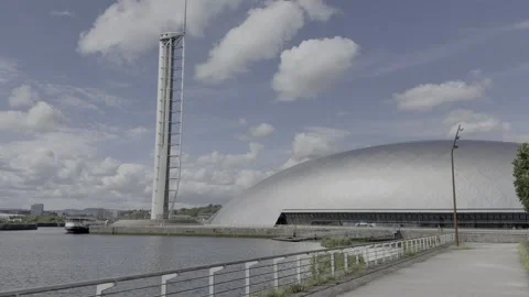 White clouds in a bright blue sky moving behind the Science Centre Tower. Stock Footage 336871331