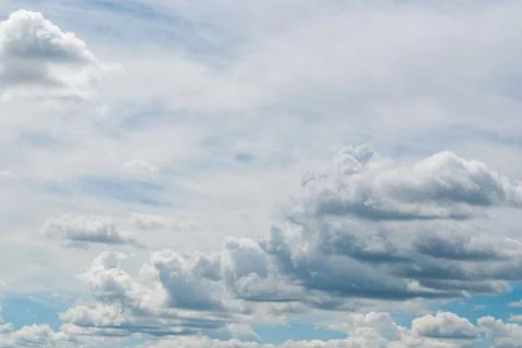 White clouds in the bright blue sky Stock Photos