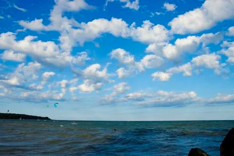 White clouds in bright blue sky Stock Photos