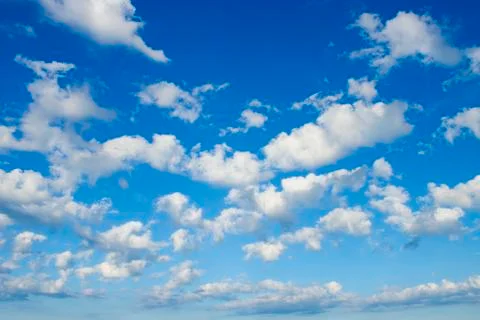 White clouds in bright blue sky Stock Photos