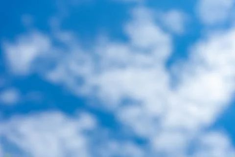 White clouds in a bright blue sky Stock Photos