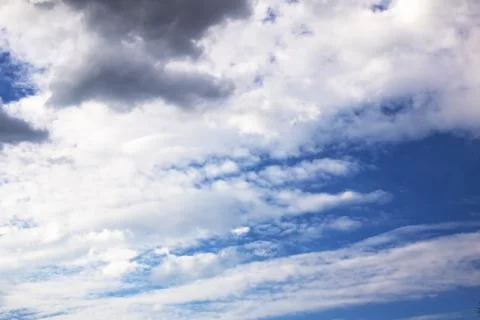 White clouds in bright blue sky closeup Stock Photos