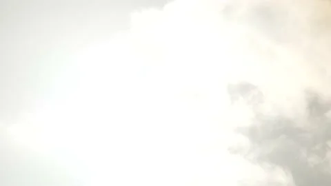 White clouds, bright sky background with sun - backlight - Time Lapse Stock Footage 154631949