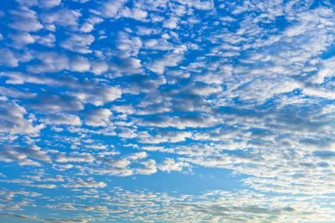 White clouds chains in blue sky Stock Photos