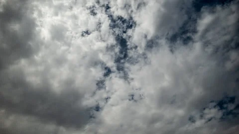 White Clouds Churn across Blue Sky Time Lapse Stock Footage 281702340