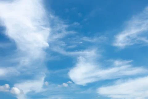 White clouds in the clear blue sky at dawn Stock Photos