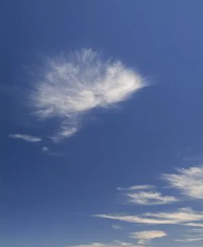 The white clouds on the clear blue sky Stock Photos