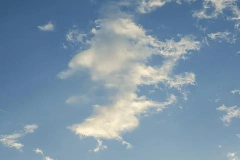 White Clouds in a Clear Blue Sky Foto stock