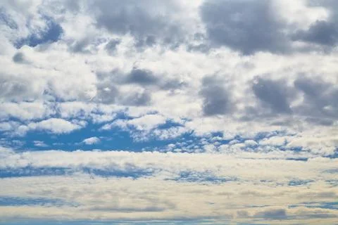 White clouds cover the sky, a celestial landscape with clouds to the horizon Stock Photos