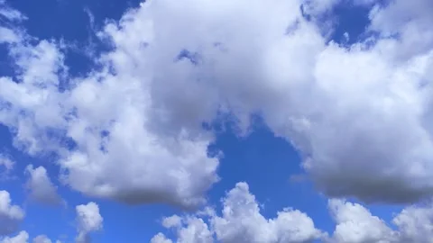 White clouds cumulus floating on blue sky, panning Stock Footage 312533291