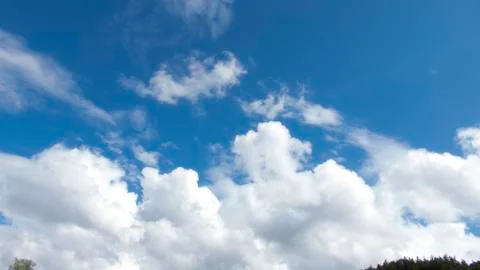 White clouds in a dark blue sky in Europe Stock-Fotos