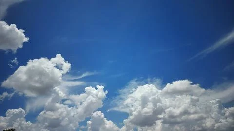 White Clouds with Deep Blue Horizon Sky Stock Photos