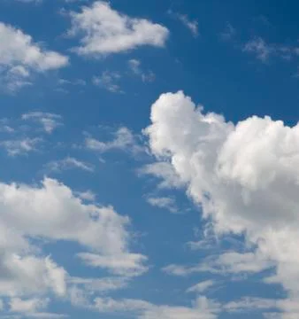 White clouds in deep blue sky Stock Photos