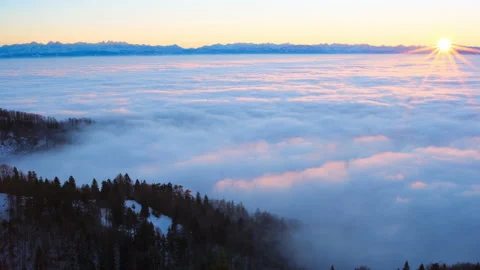 White clouds of dense fog move flowing over mountain Sunrise Stock Footage 188678827
