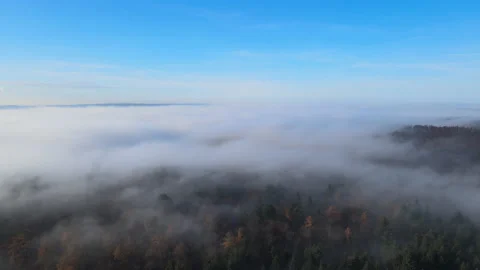 White clouds of dense fog move flowing over mountain Sunrise Stock Footage 188720665