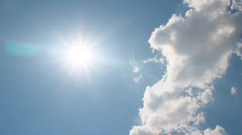 White clouds disappear in the hot sun on blue sky Stock Footage