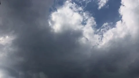 White clouds disappear in the hot sun on blue sky. Time-lapse motion clouds blue Stock Footage 76760927