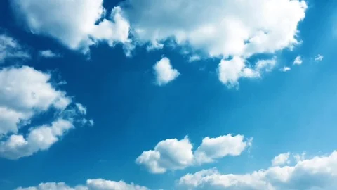 White clouds disappear in the hot sun on blue sky. Time-lapse motion clouds blue Stock Footage 76843291