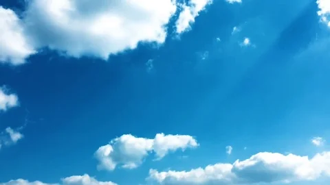 White clouds disappear in the hot sun on blue sky. Time-lapse motion clouds blue Stock Footage 76843306