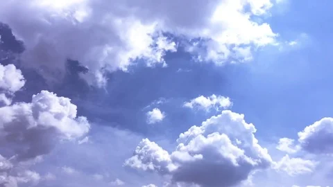 White clouds disappear in the hot sun on blue sky. Time-lapse motion clouds blue Stock Footage 76843765