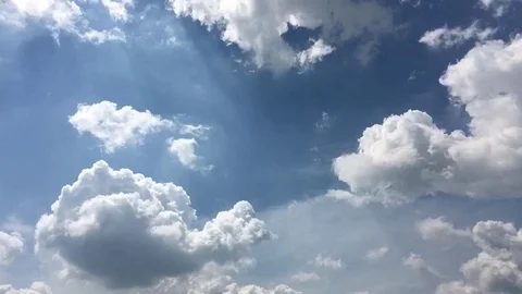 White clouds disappear in the hot sun on blue sky. Time-lapse motion clouds blue Stock Footage 76843880