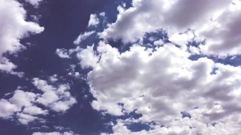 White clouds disappear in the hot sun on blue sky.Time-lapse motion clouds blue Stock Footage